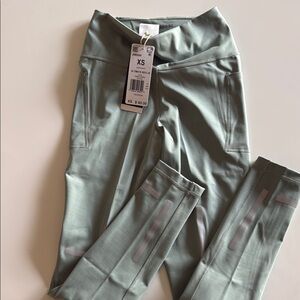 adidas women’s reflective Leggings with back zipper pocket and side pockets